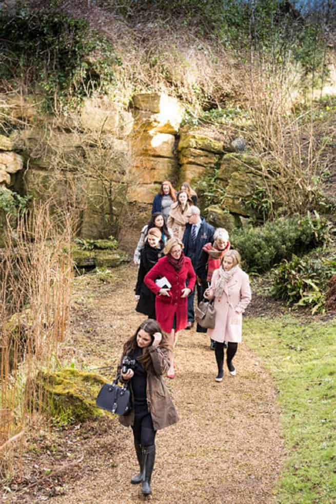 A group exploring the grounds of a venue in a showround.
