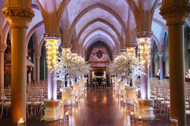 Styled wedding chapel aisle flowers and candles | Kelly Chandler Consulting