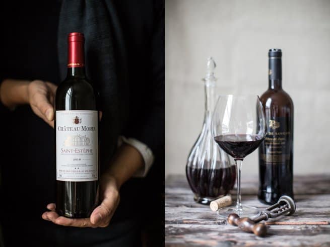 Hands holding red wine bottle | styled photo of red wine decanter red wine glass and bottle | Kelly Chandler Consulting