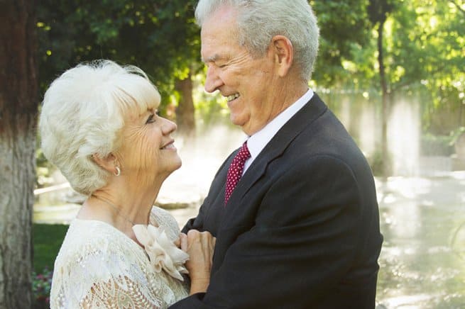 Elderly couple getting married | hugging outdoors | Kelly Chandler Consulting