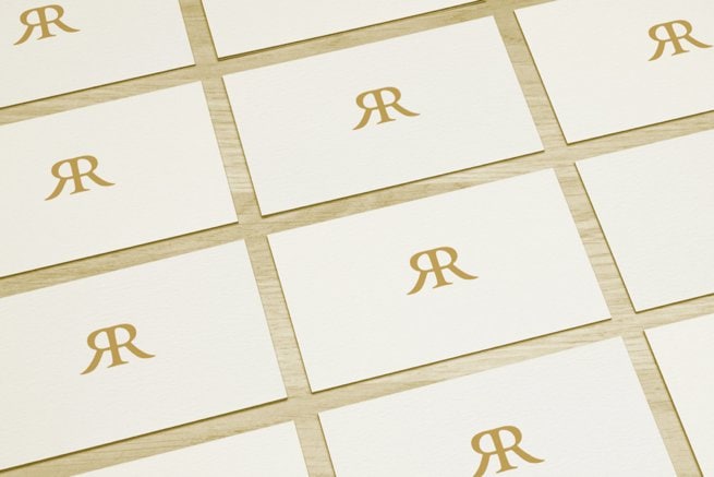White card with gold monogram | Kelly Chandler Consulting