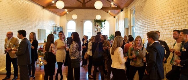 Indoor standing social gathering | Kelly Chandler 