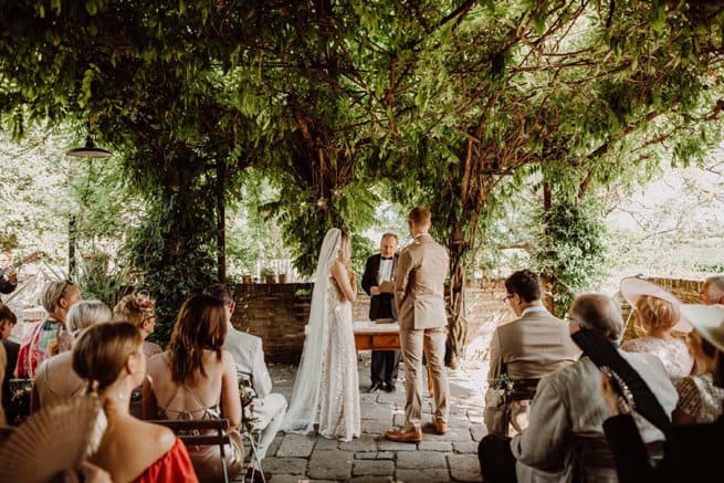Outdoor bride and groom exchanging vows | Kelly Chandler Consulting