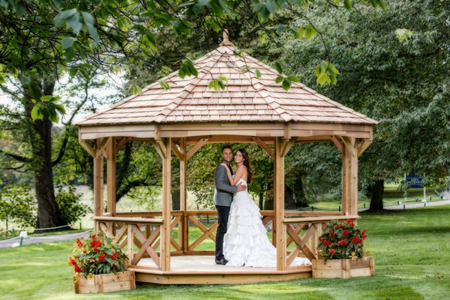 Bride and groom under a gazebo | Kelly Chandler Consulting