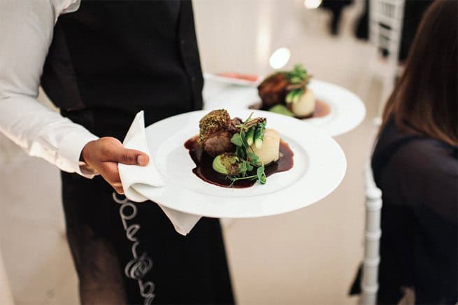 Waiting carrying a steak on a plate | Kelly Chandler Consulting