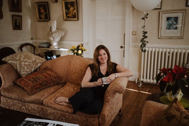 Lady on sofa drinking tea | Kelly Chandler Consulting