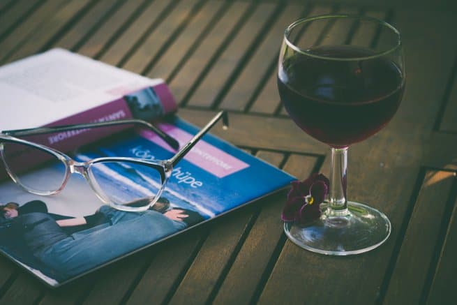 reading glasses book and a glass of red wine | Kelly Chandler consulting