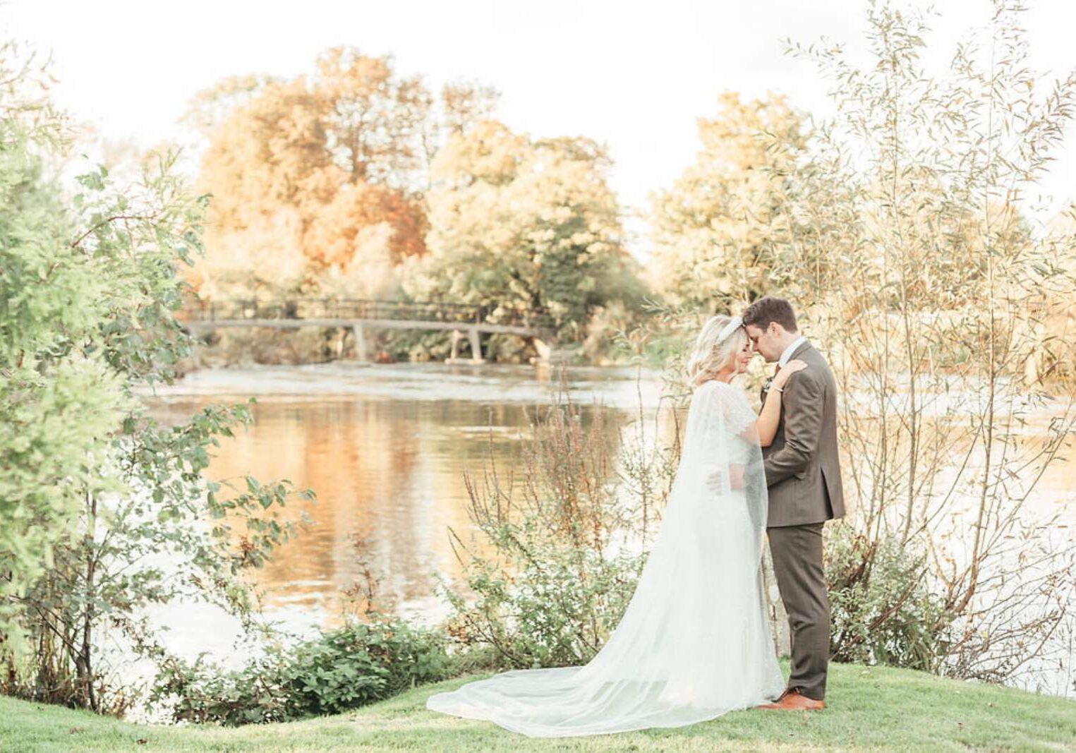 Wedding-couple-standing-on-a-river-bank